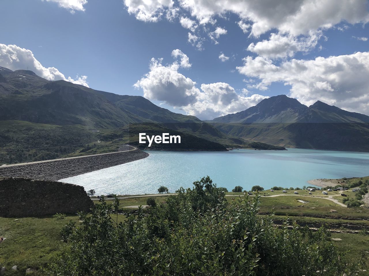 Scenic view of lake and mountains against sky