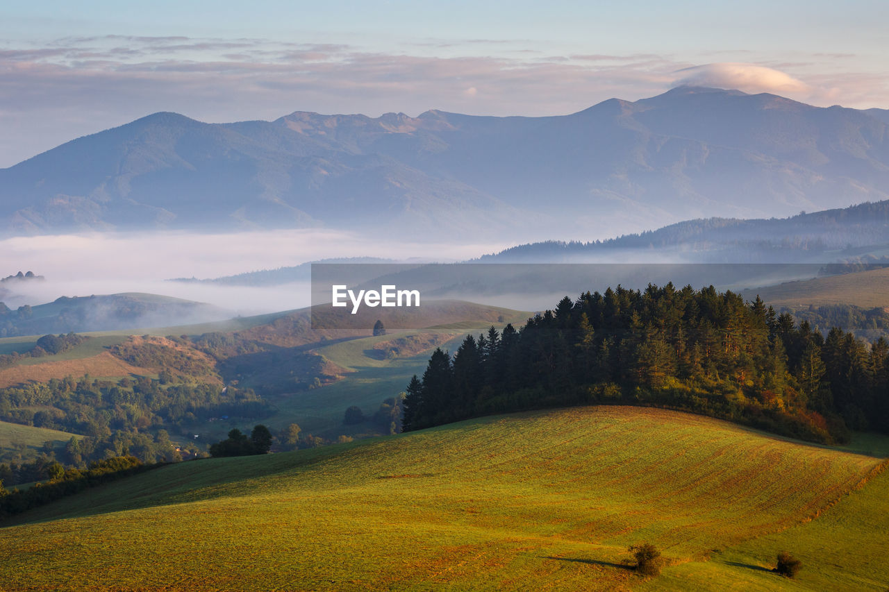 Fog in the valley of turiec region and view of mala fatra.