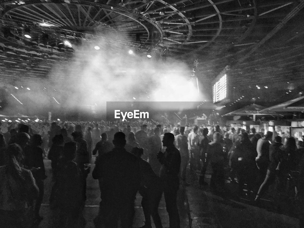 CROWD ENJOYING MUSIC CONCERT AT NIGHT