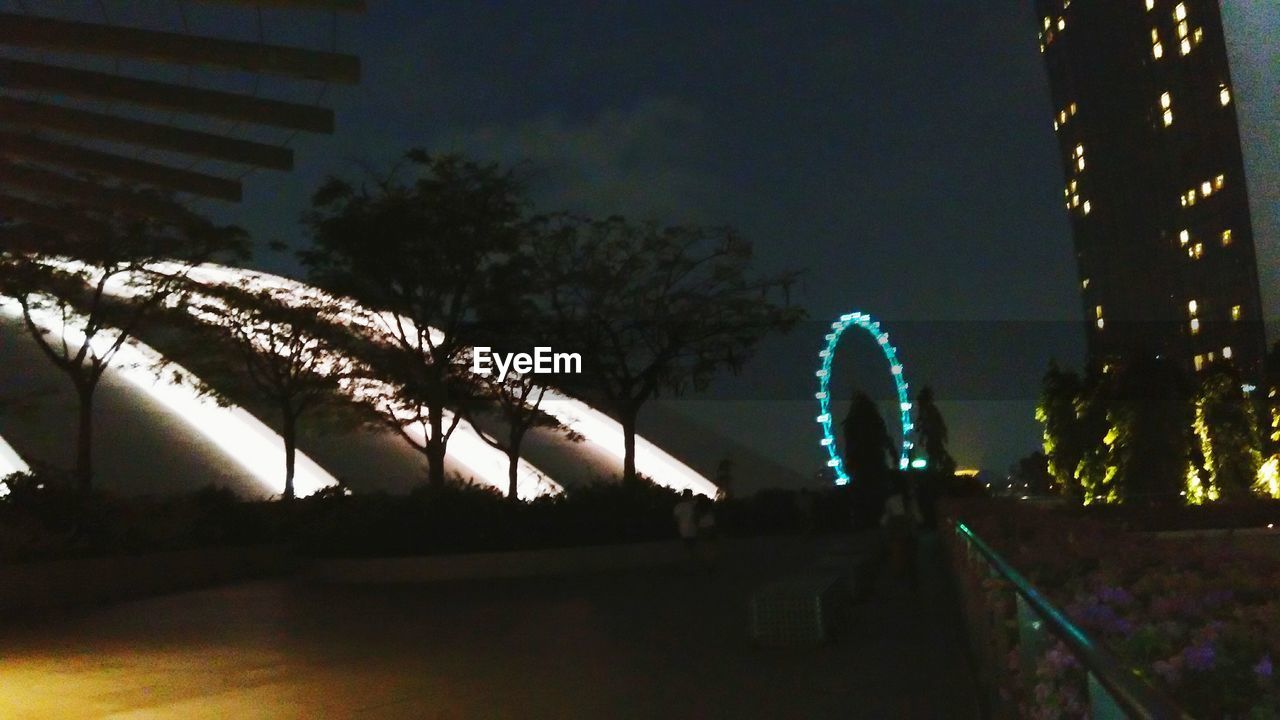 LOW ANGLE VIEW OF ILLUMINATED STREET LIGHT AT NIGHT