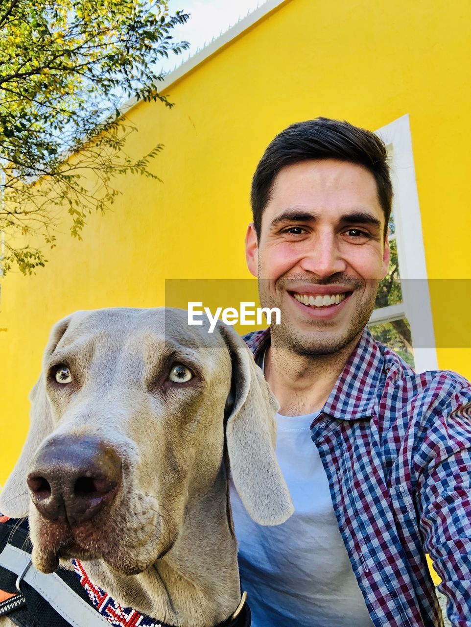 Portrait of young man with dog