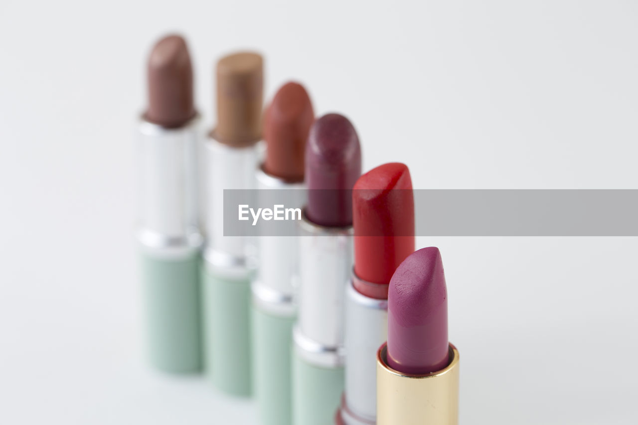 Close-up of lipsticks against white background