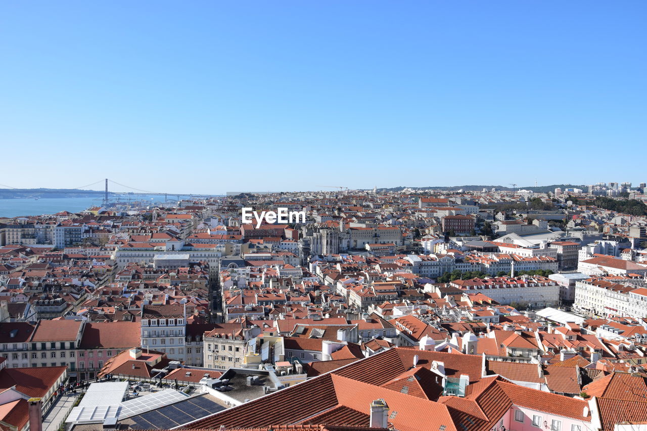 High angle shot of townscape against clear blue sky