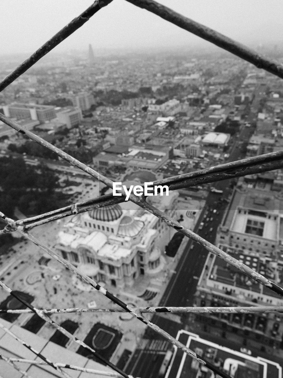 High angle view of city seen through fence