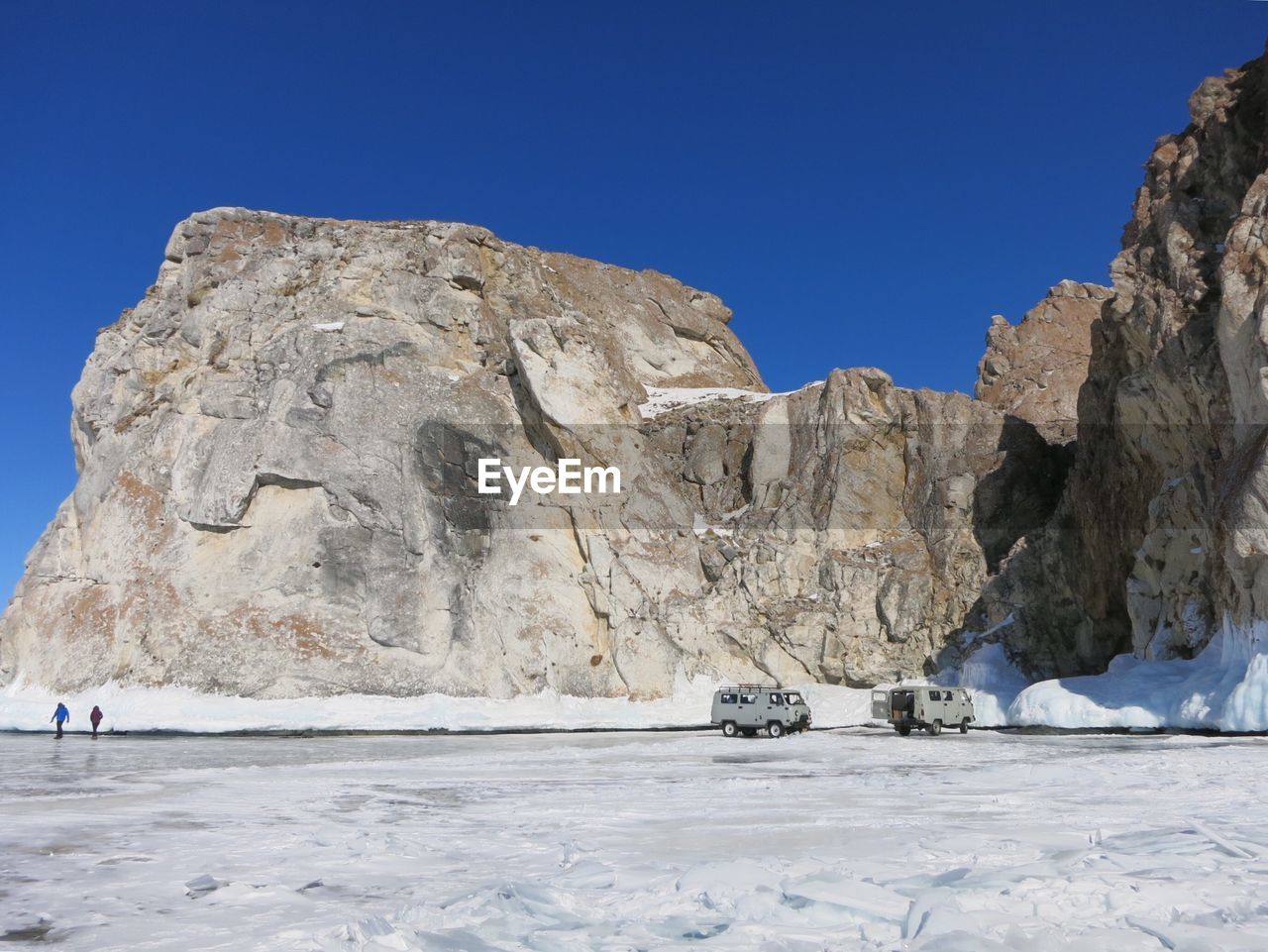 VIEW OF ROCK FORMATION AGAINST CLEAR BLUE SKY