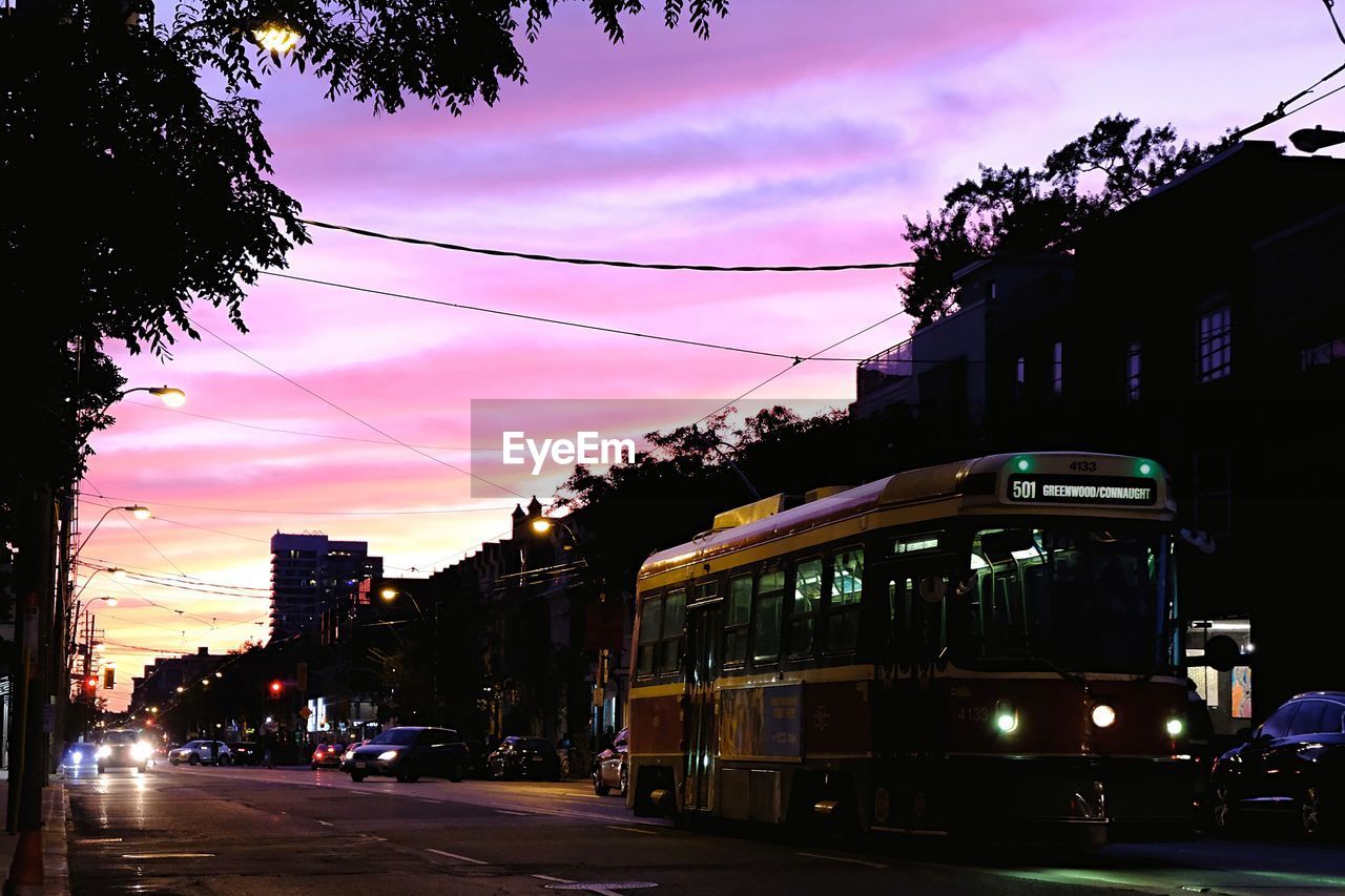 VIEW OF CITY STREET AT SUNSET