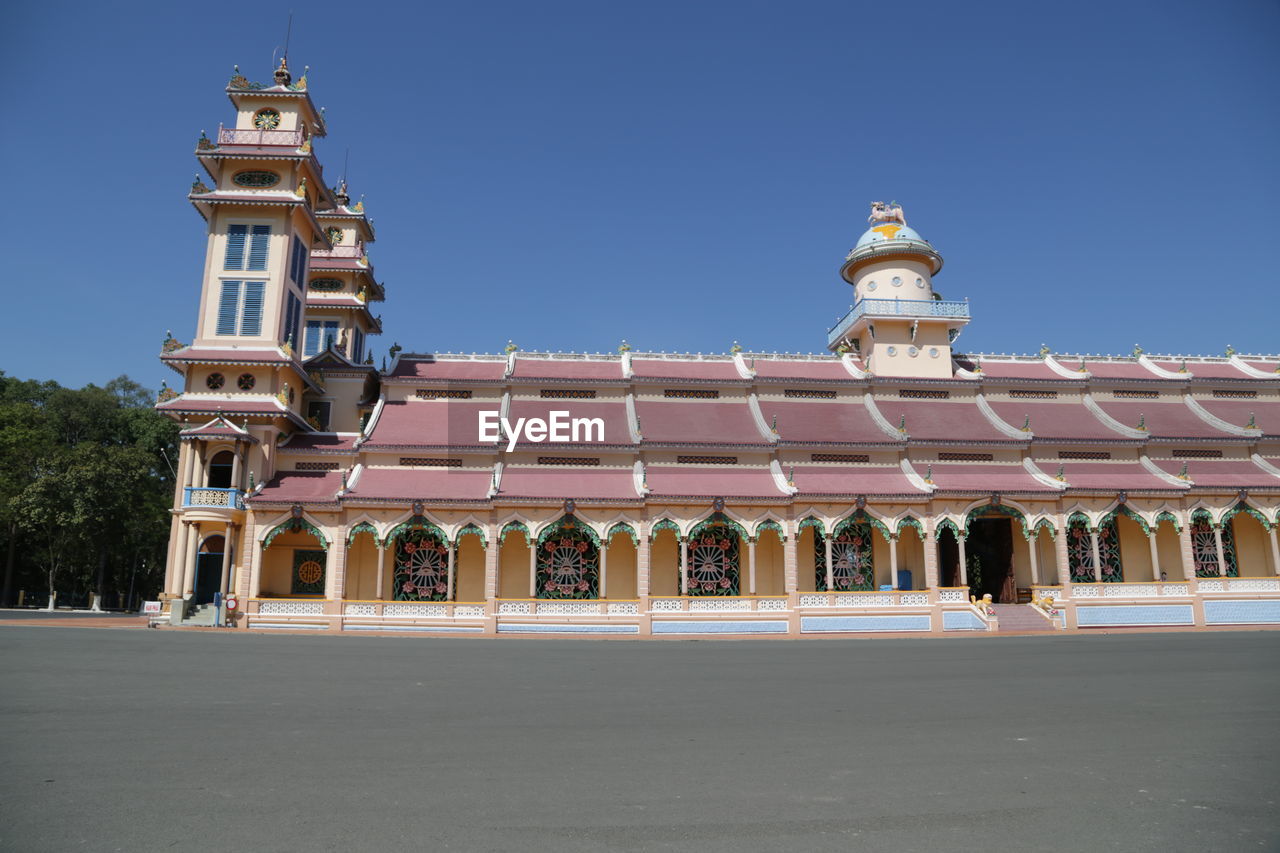 Low angle view of building against blue sky