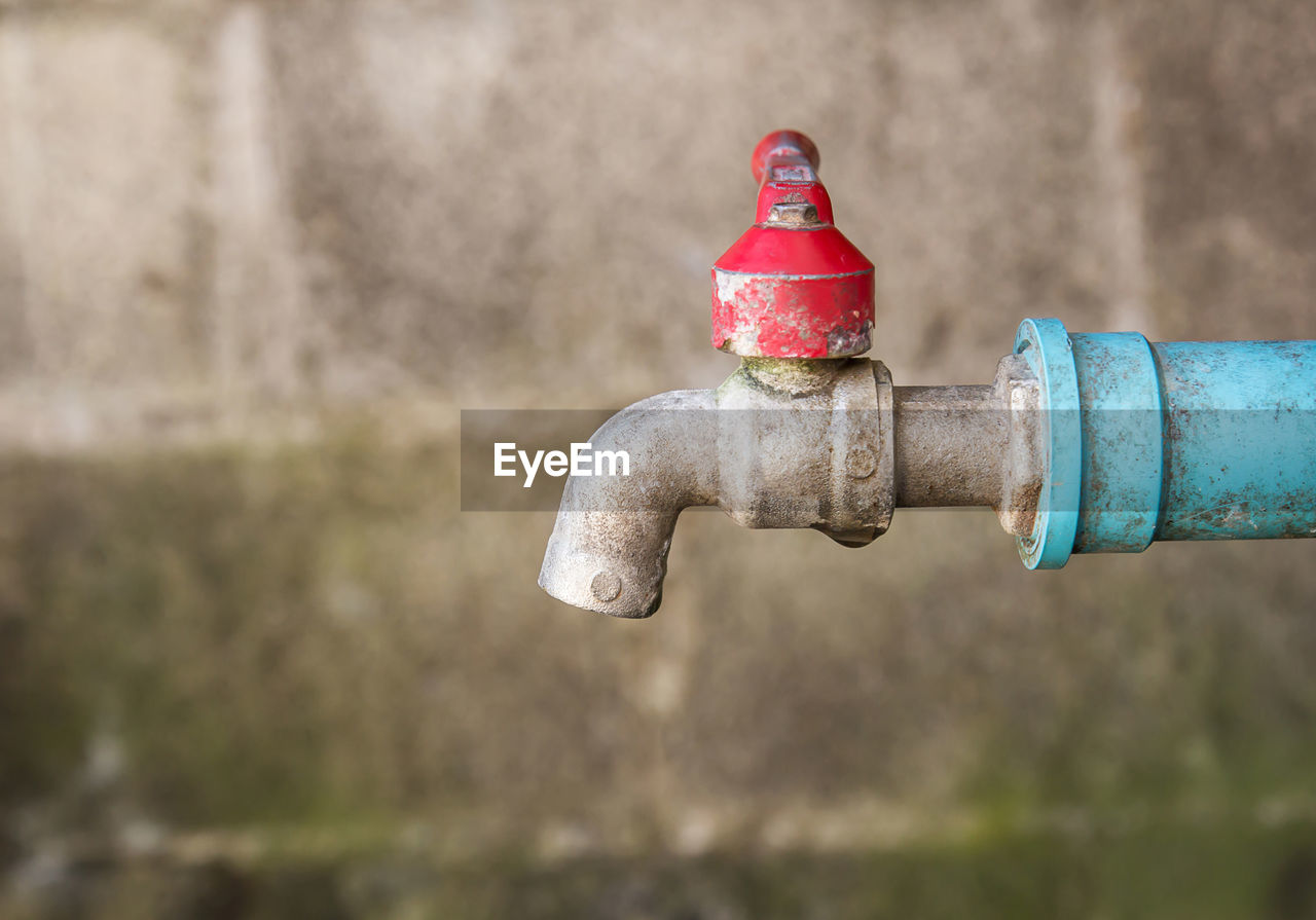 Close-up of water pipe against wall