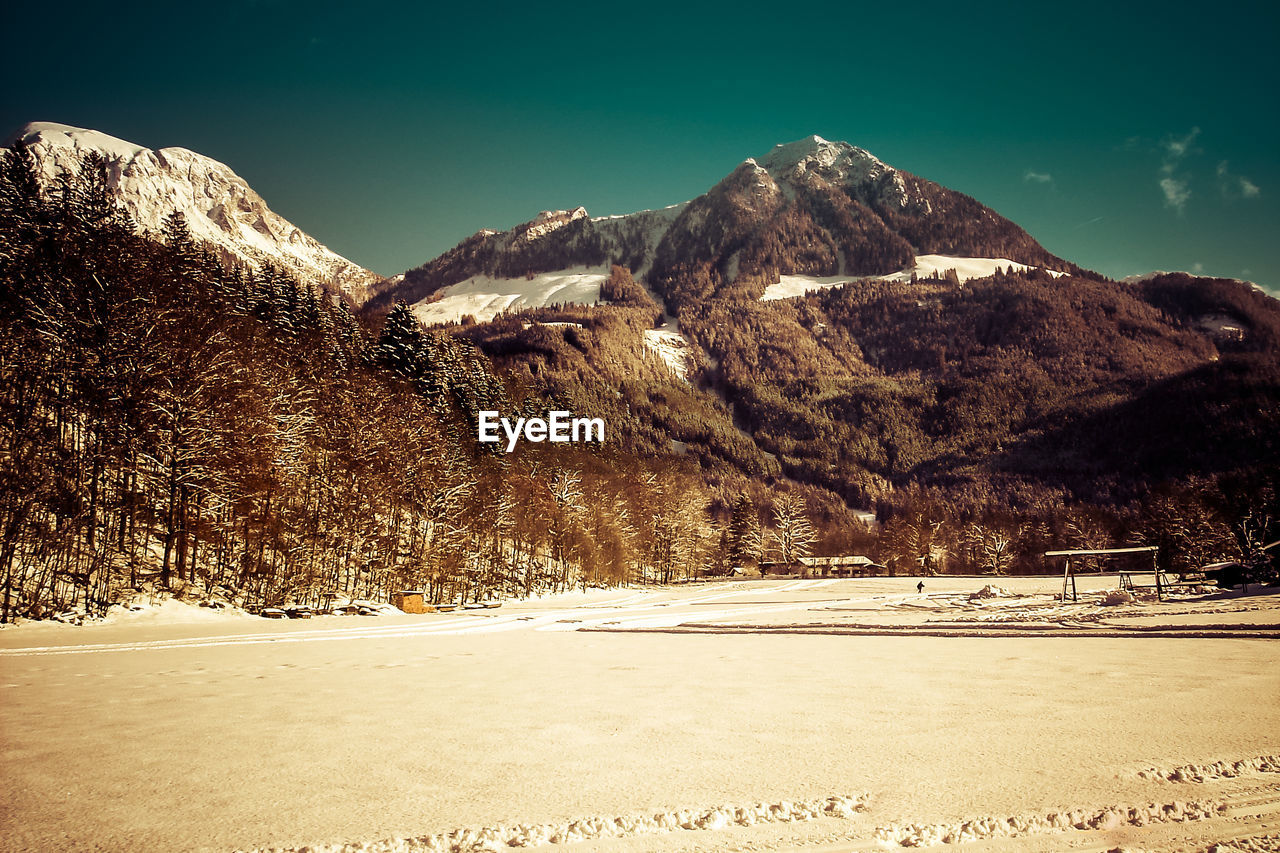 SNOWCAPPED MOUNTAINS AGAINST SKY