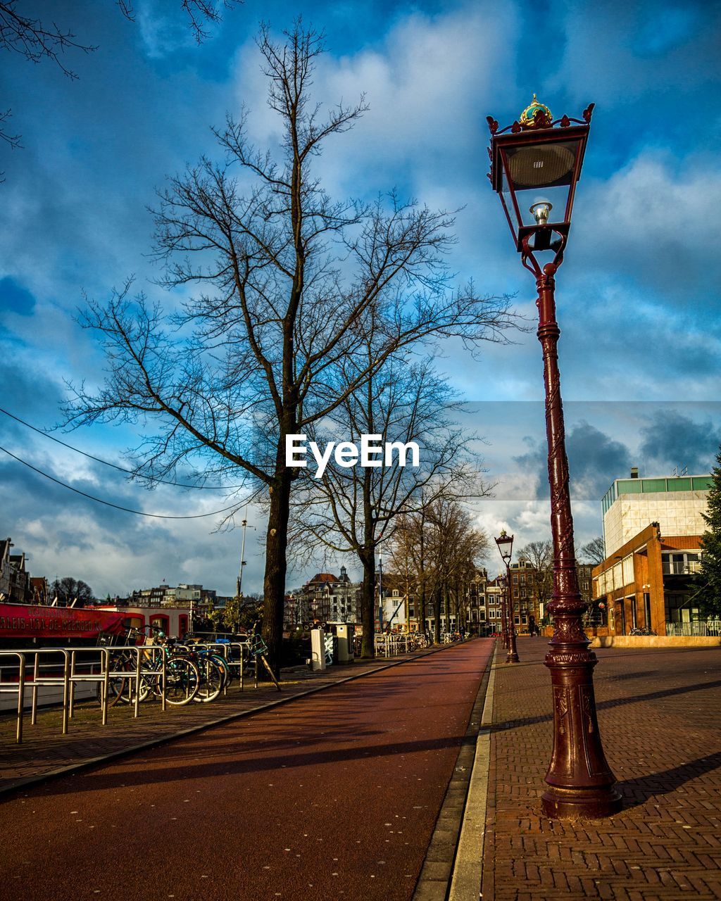 VIEW OF STREET LIGHT AGAINST CLOUDY SKY