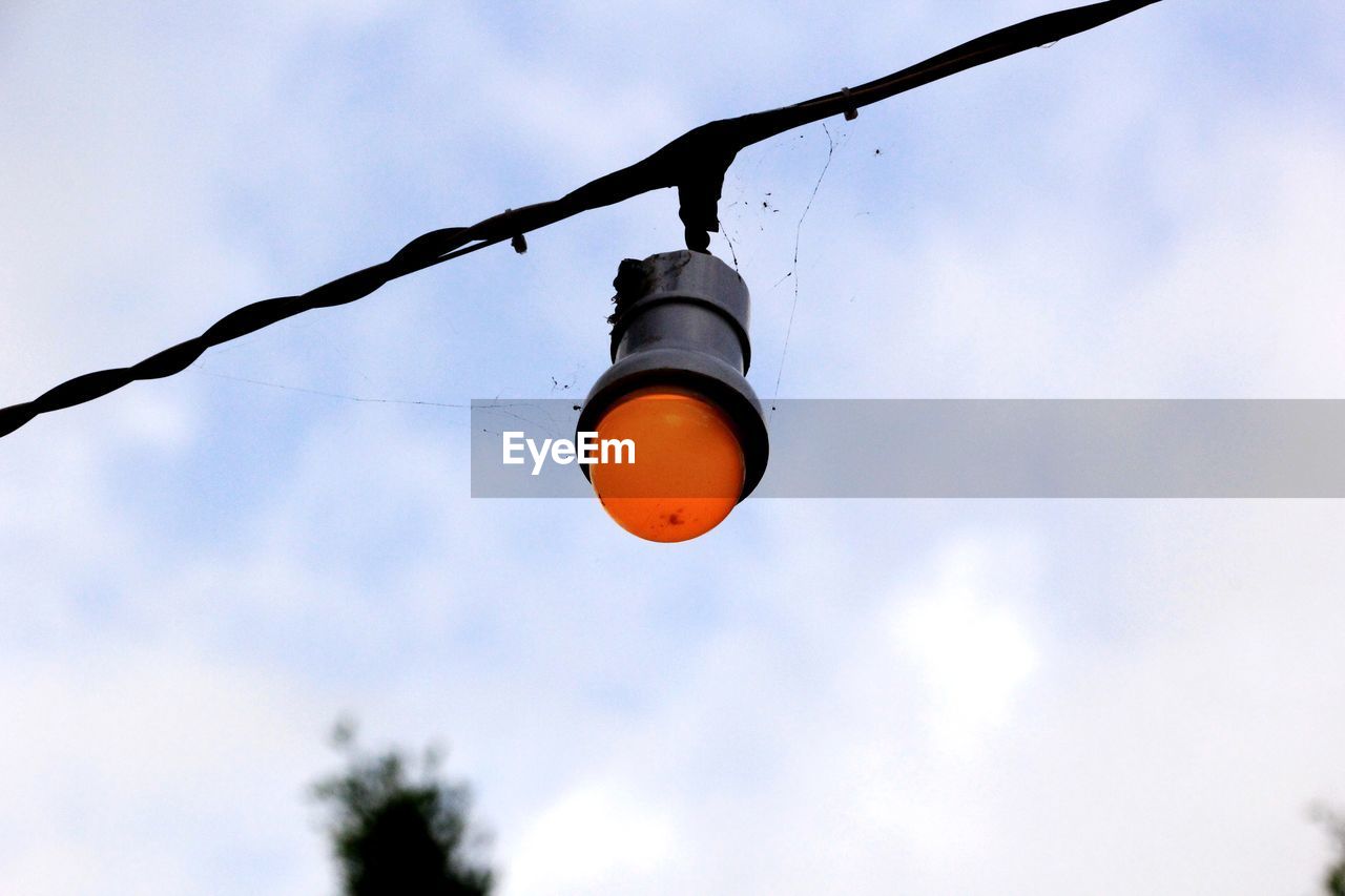 Low angle view of street light against sky 