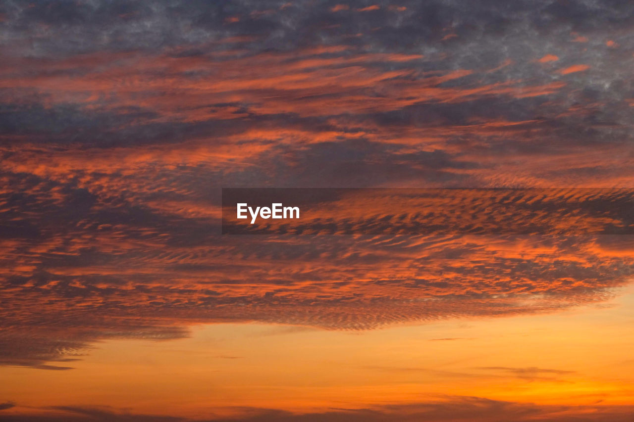 Low angle view of dramatic sky during sunset