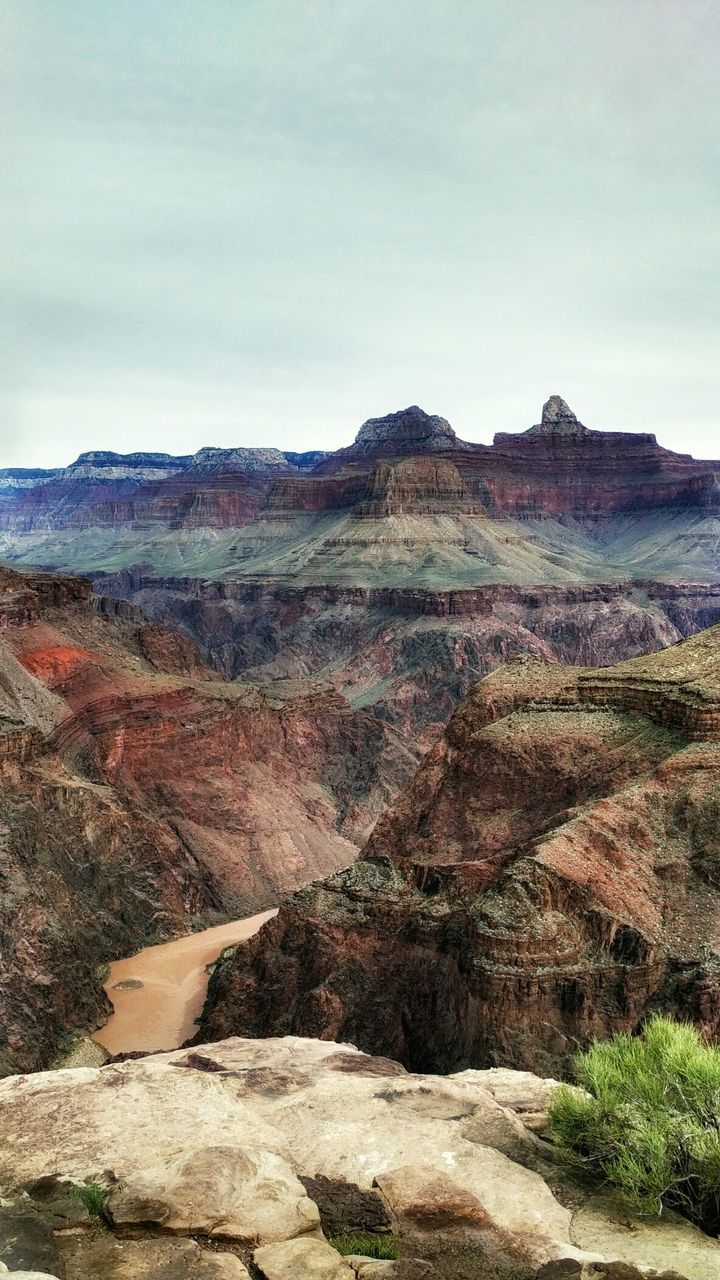 Rock formation at grand canyon against sky