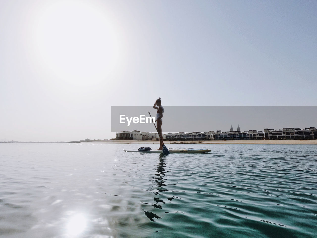 Woman doing stand up paddle boarding