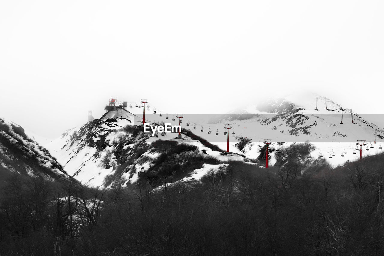 SCENIC VIEW OF MOUNTAINS AGAINST SKY DURING WINTER