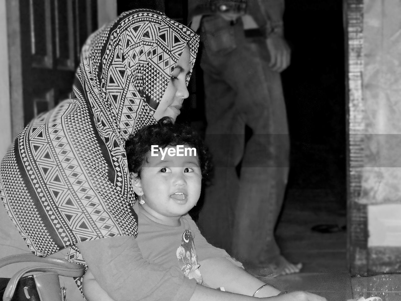 Mother sitting with daughter at home