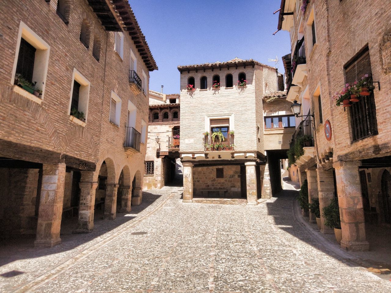 COBBLESTONE STREET AMIDST BUILDINGS