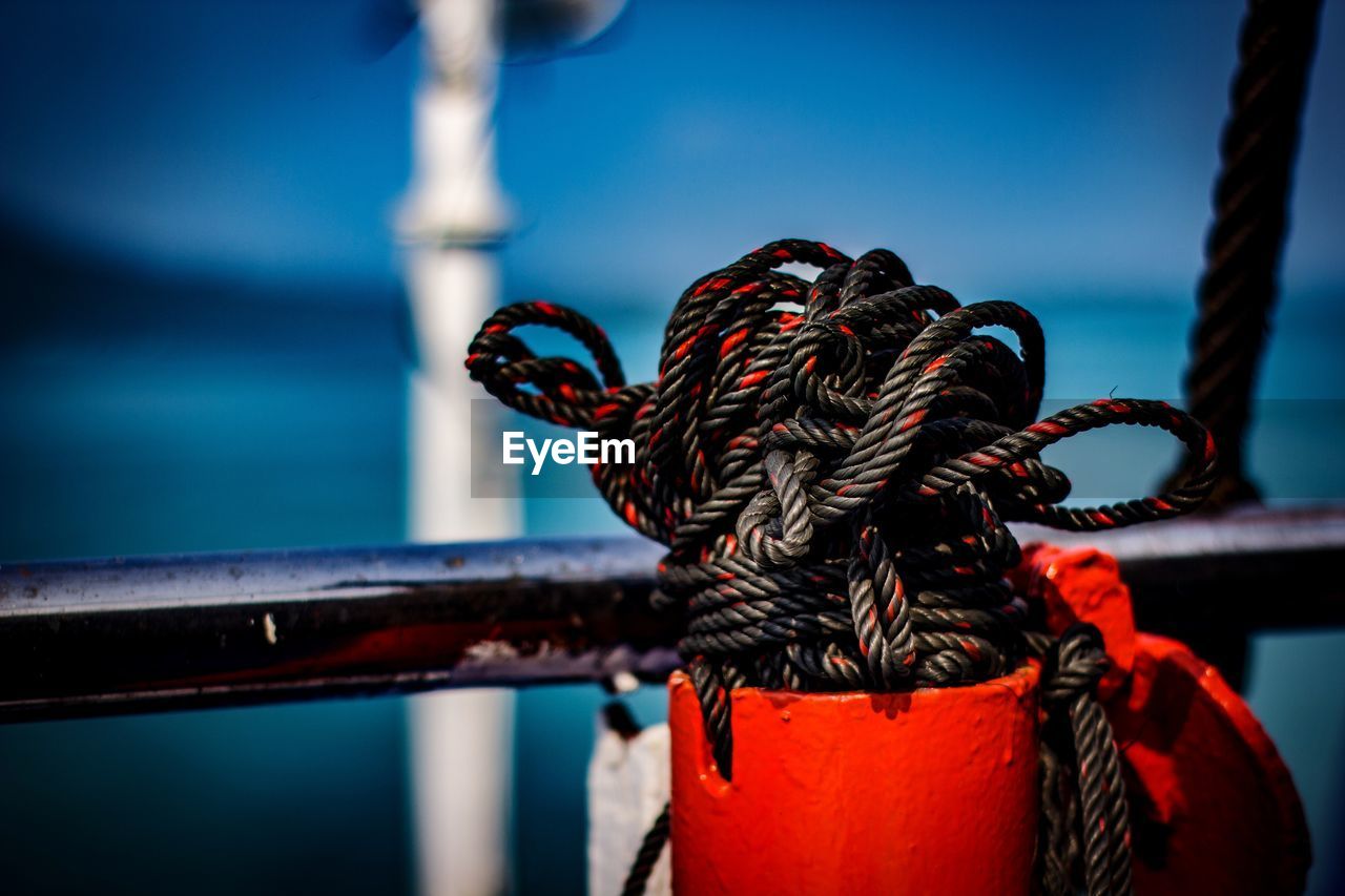 Close-up of rope tied to railing