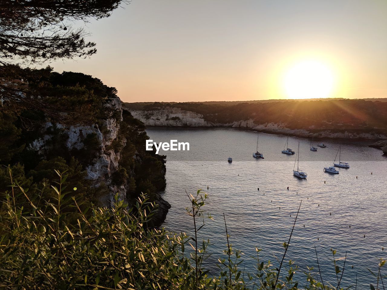 Scenic view of sea against clear sky during sunset
