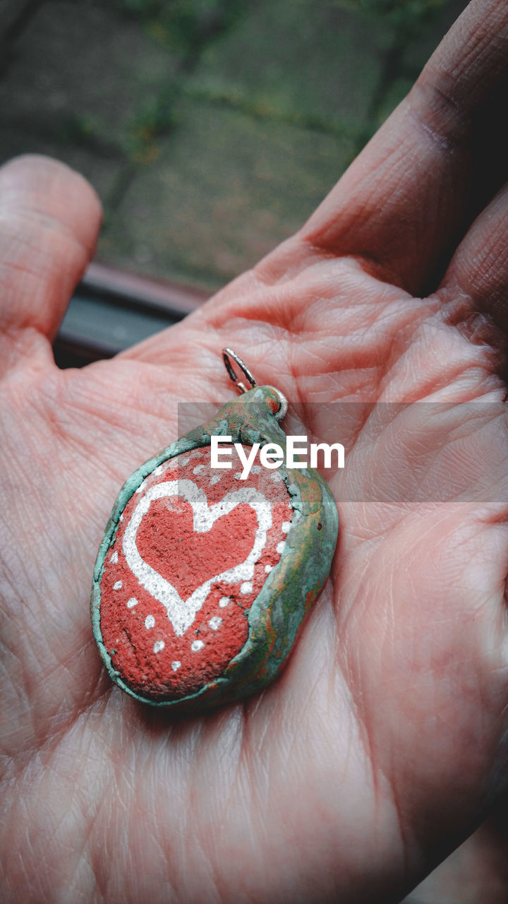 Close-up of hand holding heart shape