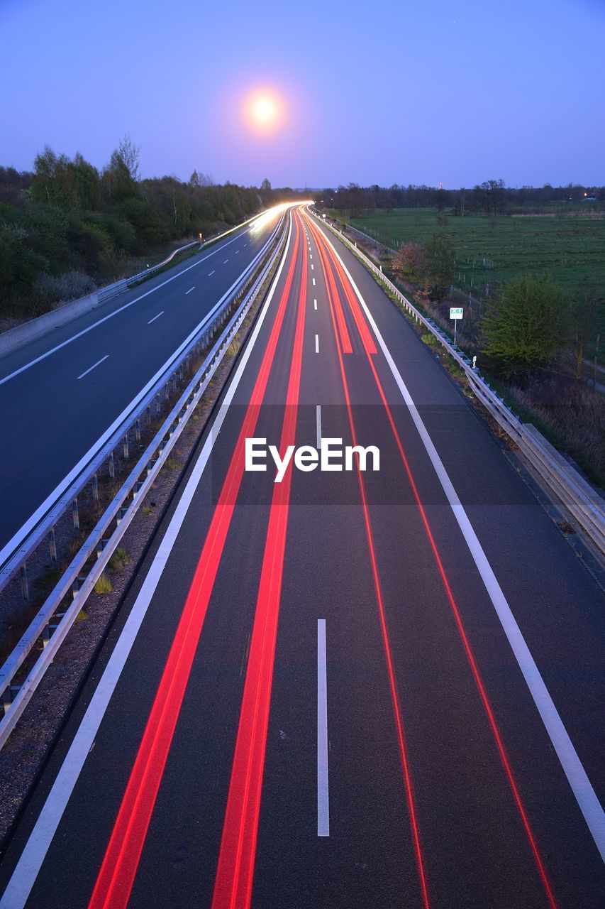 Long exposure of vehicle on road at night