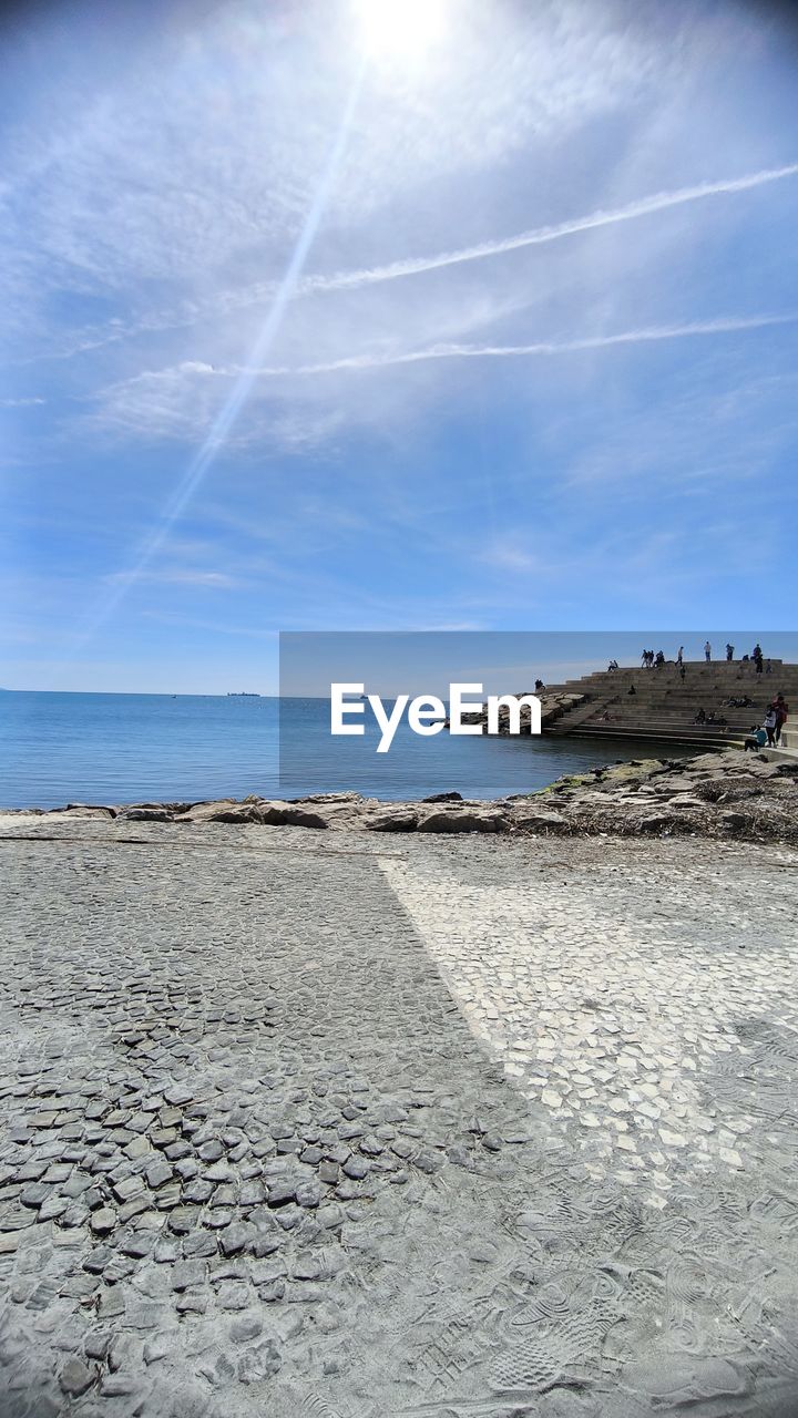 sky, water, sea, land, horizon, ocean, beach, shore, wave, nature, scenics - nature, cloud, beauty in nature, coast, body of water, sunlight, tranquility, reflection, tranquil scene, horizon over water, no people, day, sand, blue, outdoors, sun, travel destinations, environment, coastline, landscape, architecture, travel, idyllic, non-urban scene