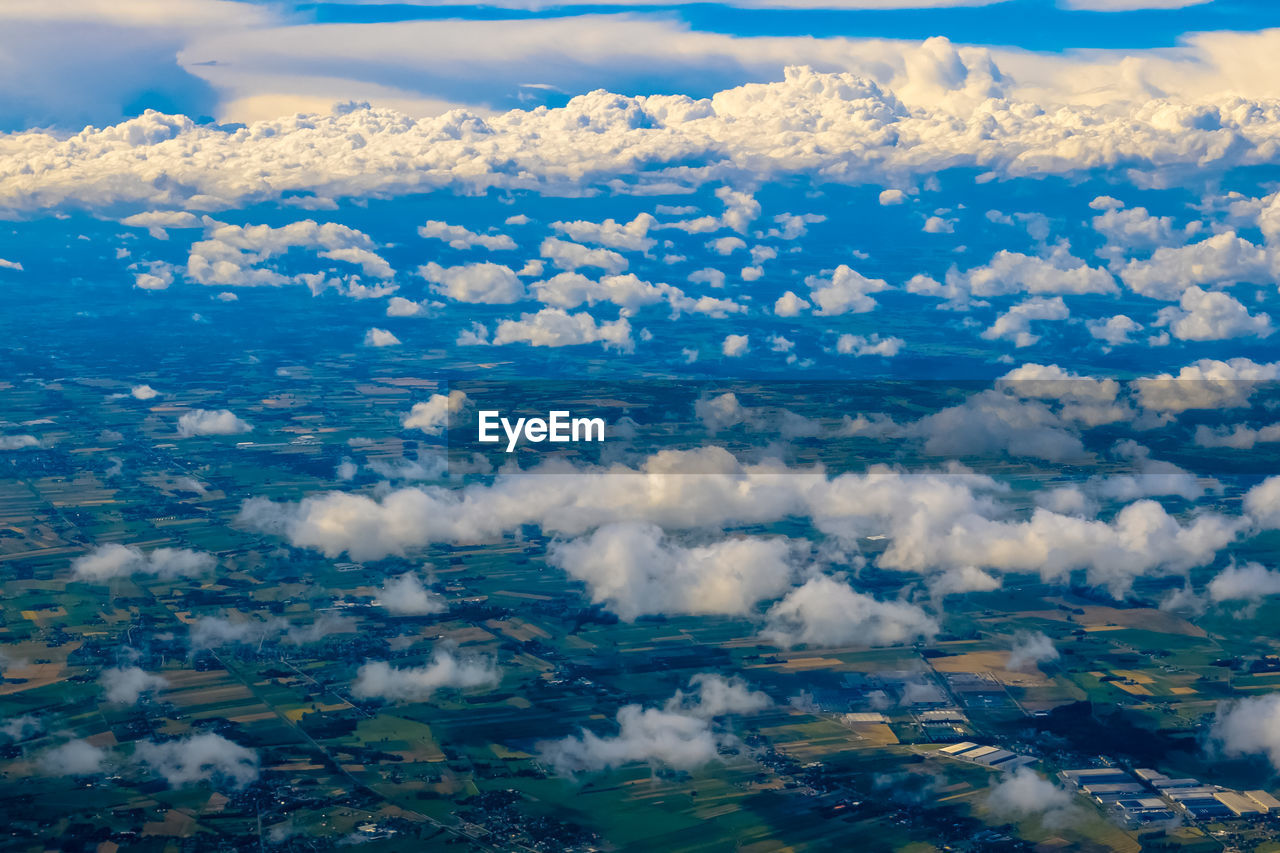 Aerial view of cloudscape over field