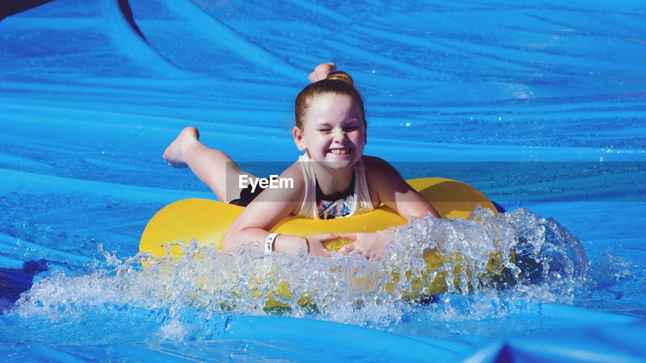 WOMAN SWIMMING IN POOL