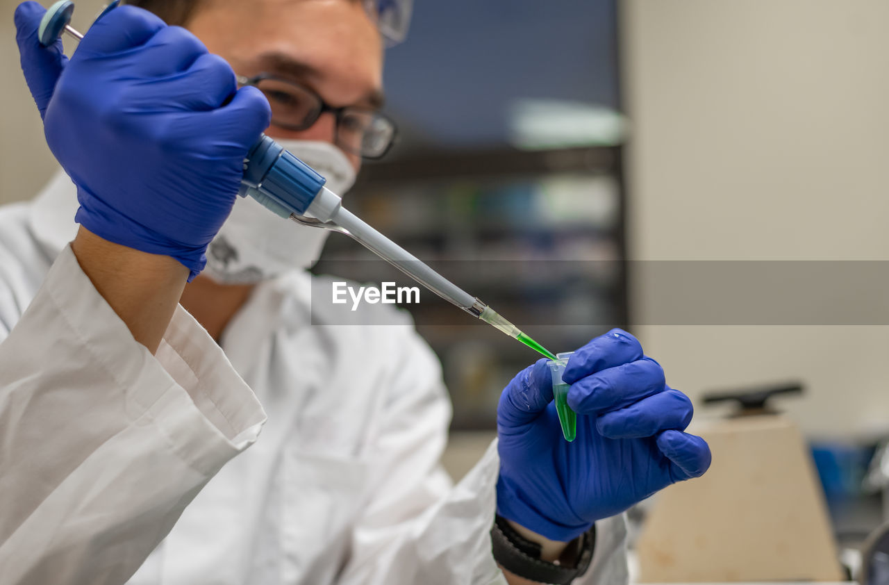 Doctor analyzing chemical in hospital