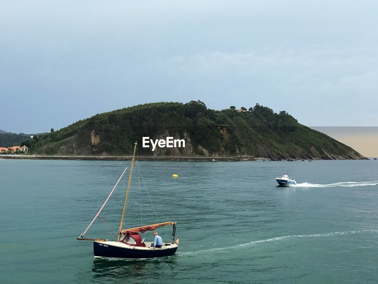 BOATS SAILING ON SEA AGAINST SKY