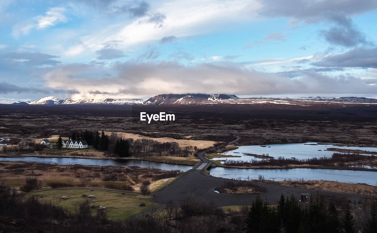 SCENIC VIEW OF LAKE AGAINST MOUNTAINS