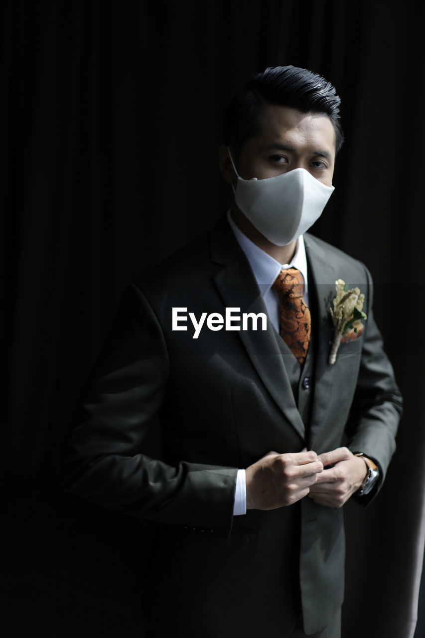 Groom with mask portrait