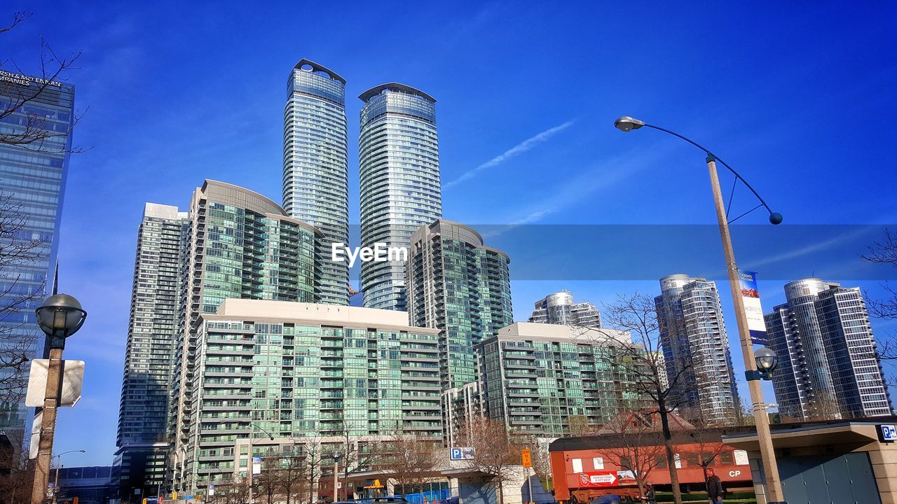 LOW ANGLE VIEW OF BUILDINGS IN CITY