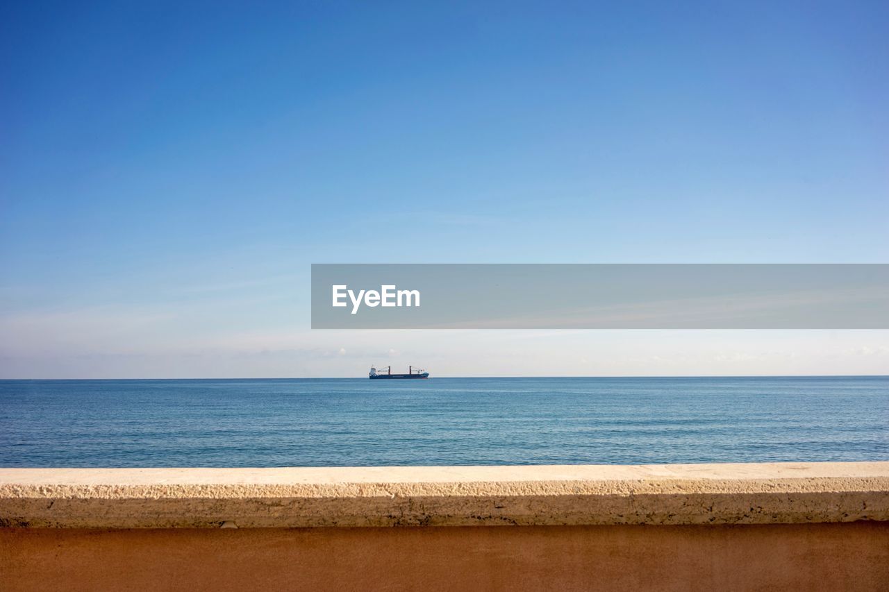 Scenic view of sea against blue sky