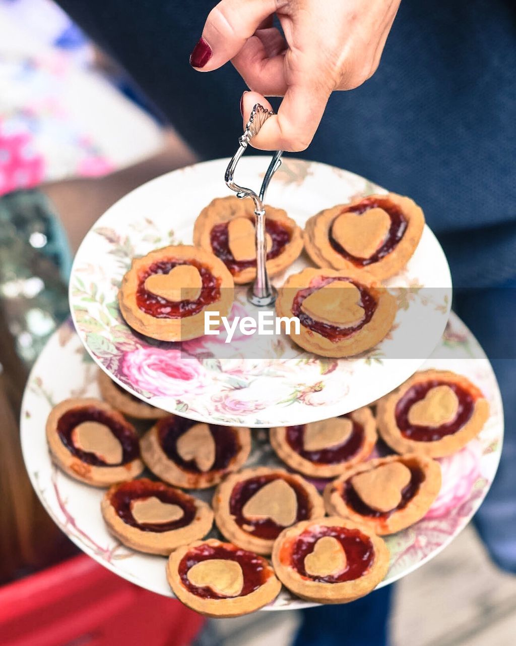 Cropped image of woman holding cookies