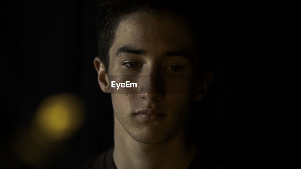 Close-up of young man looking away