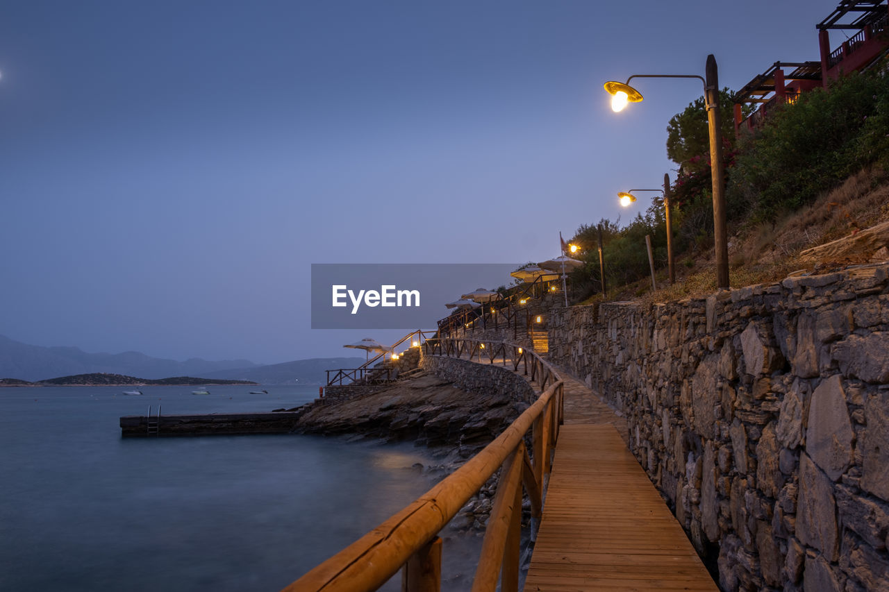 VIEW OF PIER OVER SEA AGAINST SKY