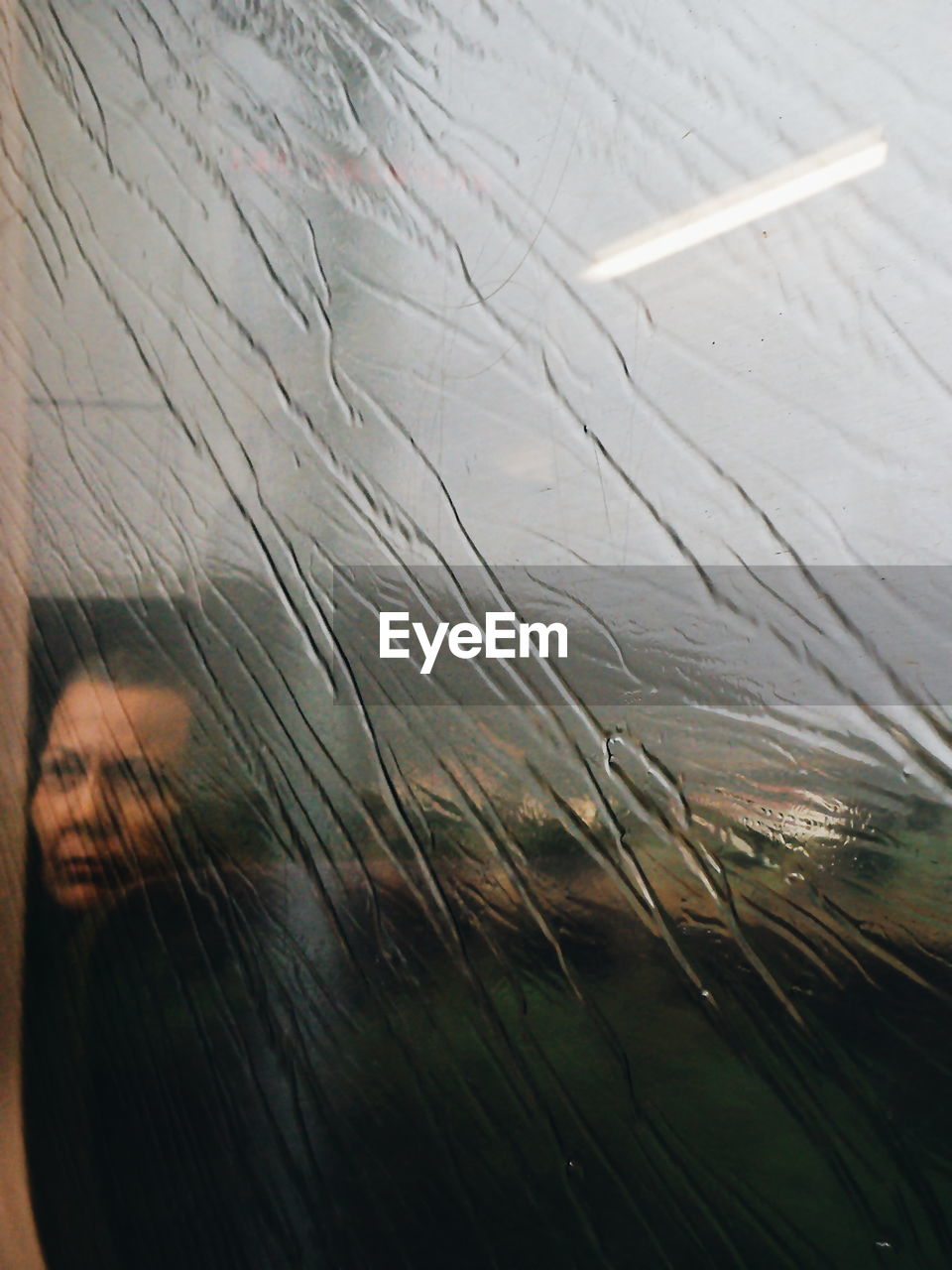 Woman seen through window