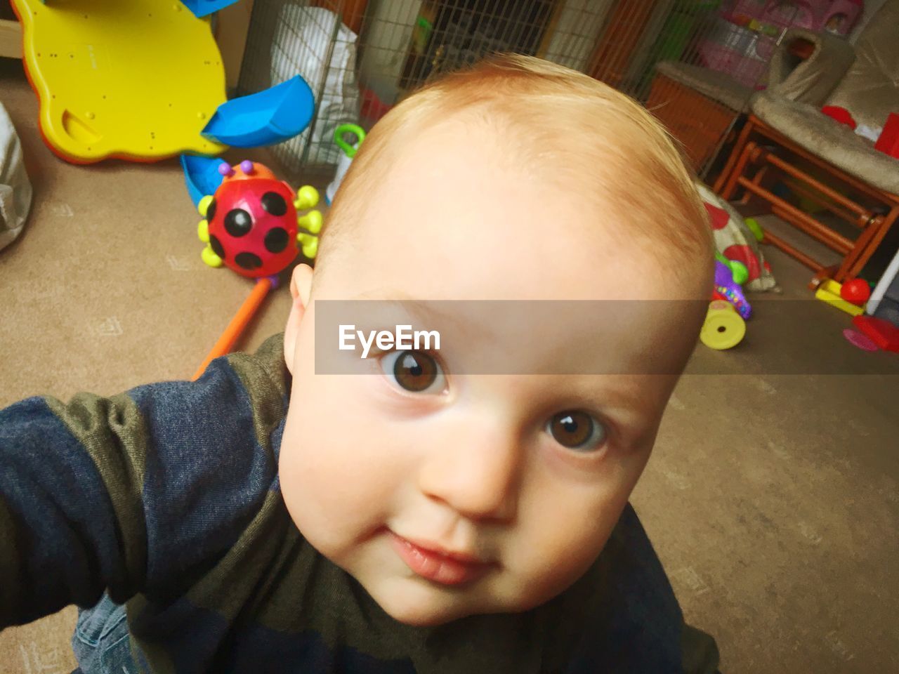 Close-up portrait of cute baby at home