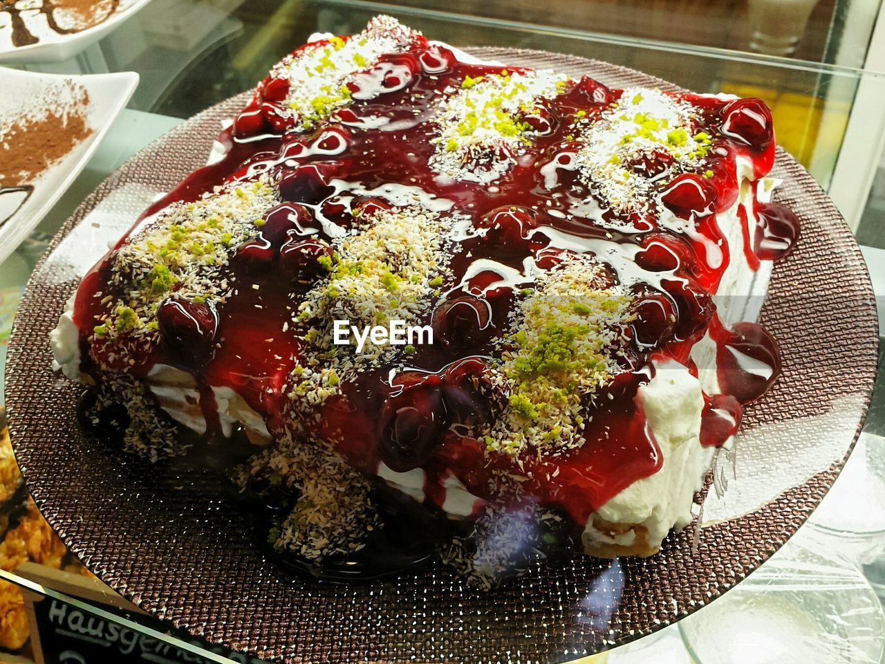 Close-up of mascarpone cheese cake in display cabinet at store