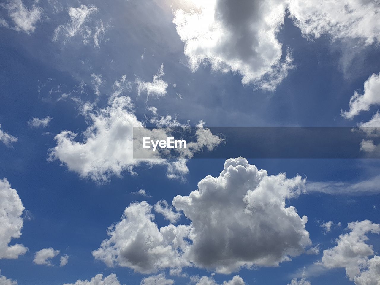 LOW ANGLE VIEW OF WHITE CLOUDS IN SKY