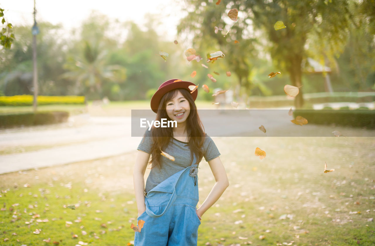 Portrait of young woman standing outdoors