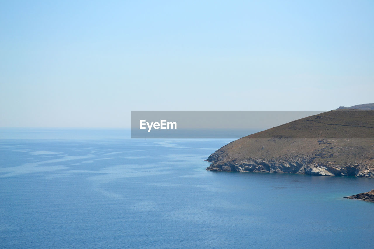 Scenic view of sea against clear blue sky