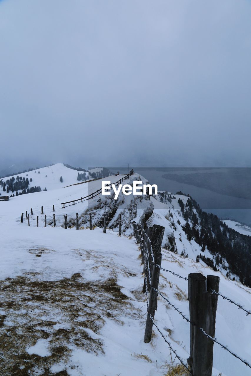 Scenic view of frozen landscape against sky