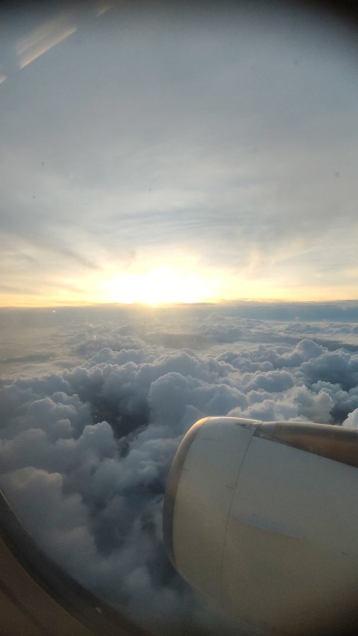 cloud, sky, air vehicle, light, airplane, nature, reflection, no people, white, transportation, sunlight, mode of transportation, flying, outer space, outdoors, environment, aerial view