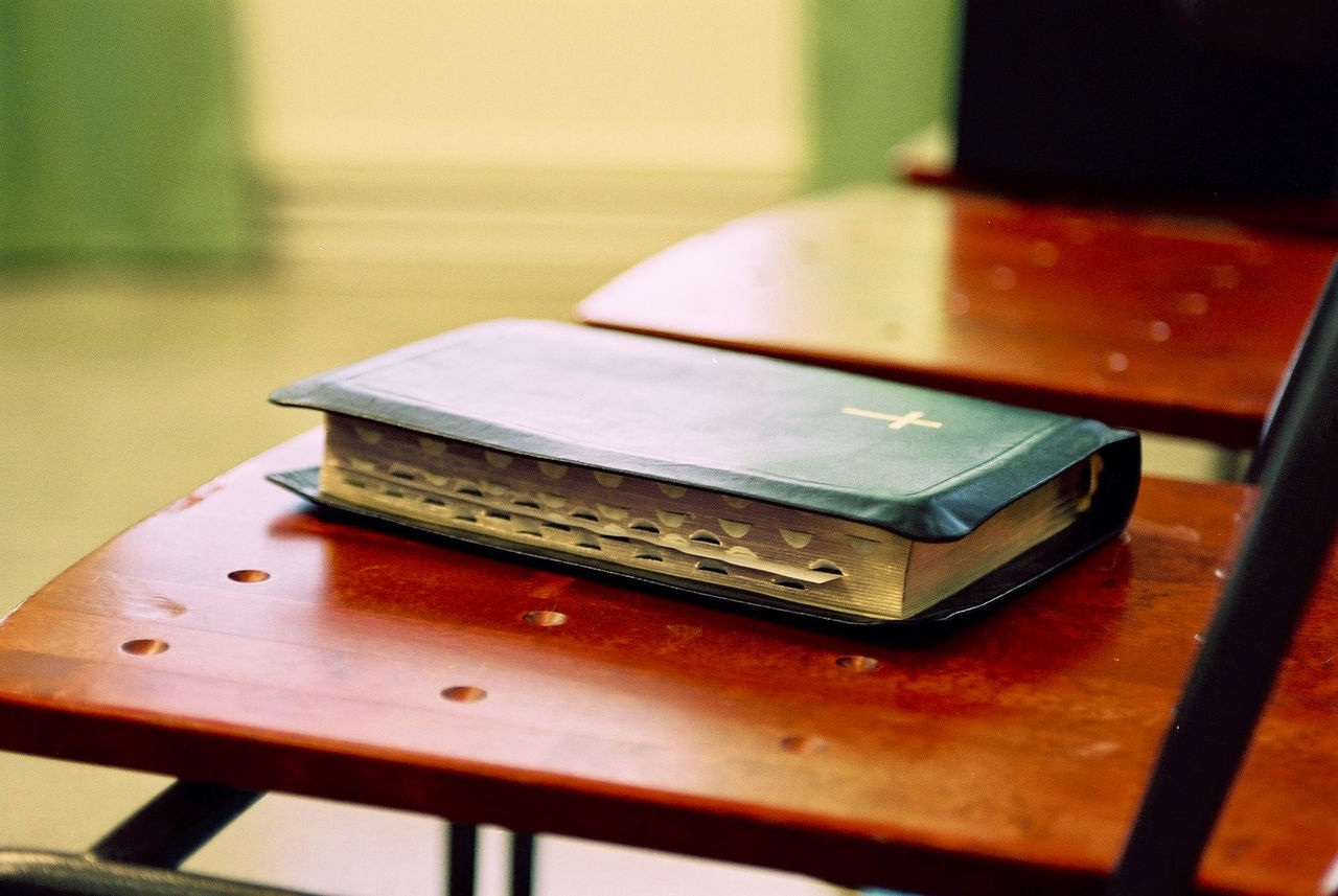 High angle view of bible on wooden table