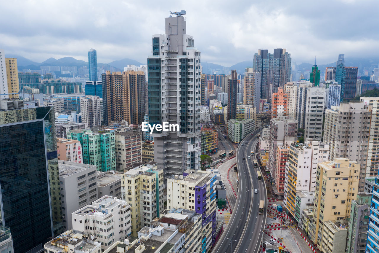 HIGH ANGLE VIEW OF CITY BUILDINGS AGAINST SKY