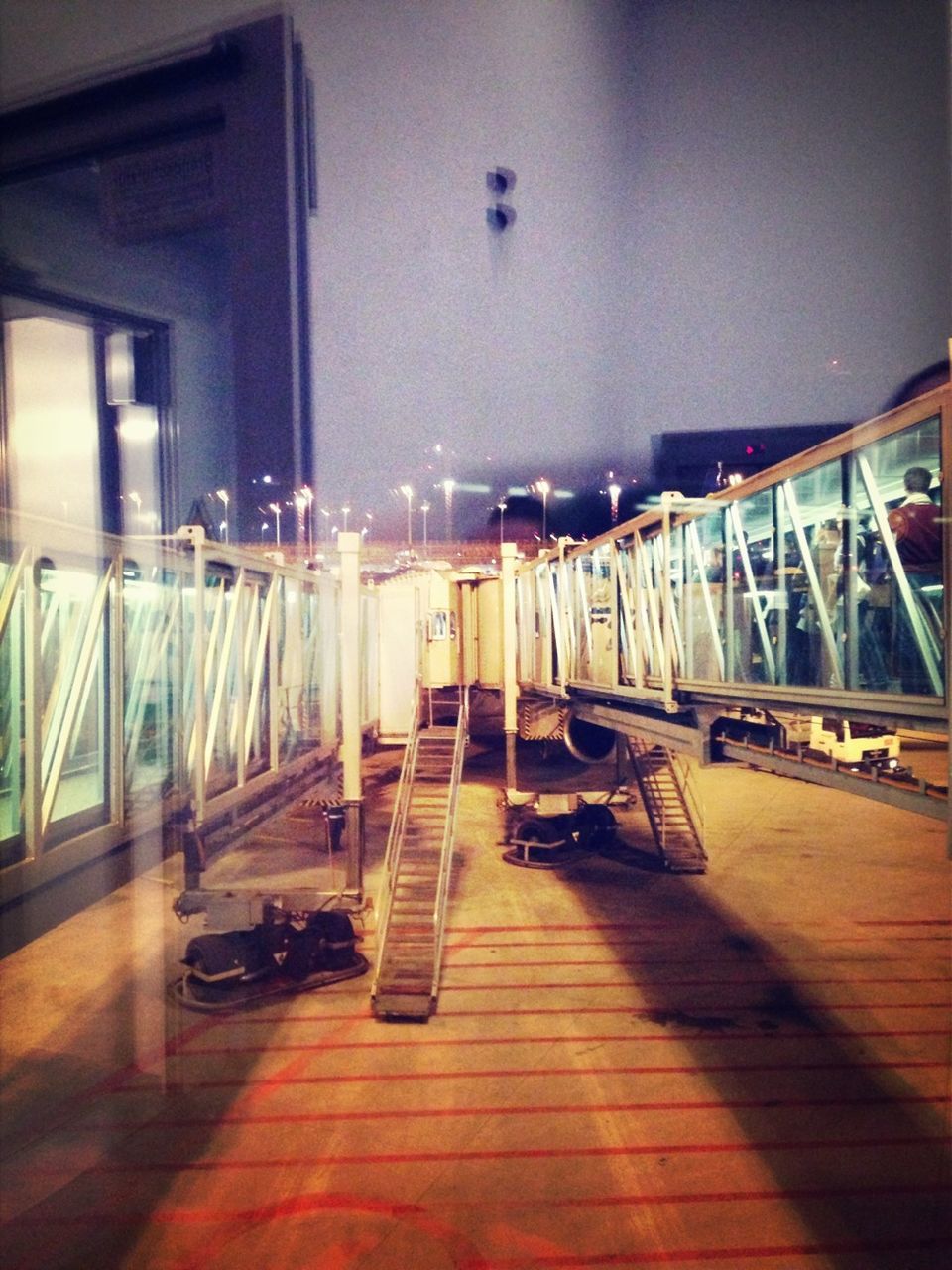 Illuminated modern walkway at airport