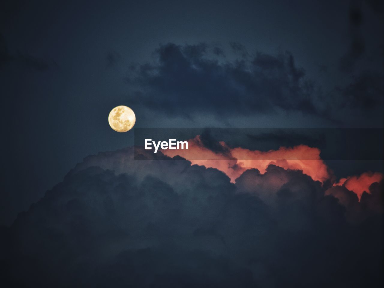 LOW ANGLE VIEW OF MOON AGAINST SKY