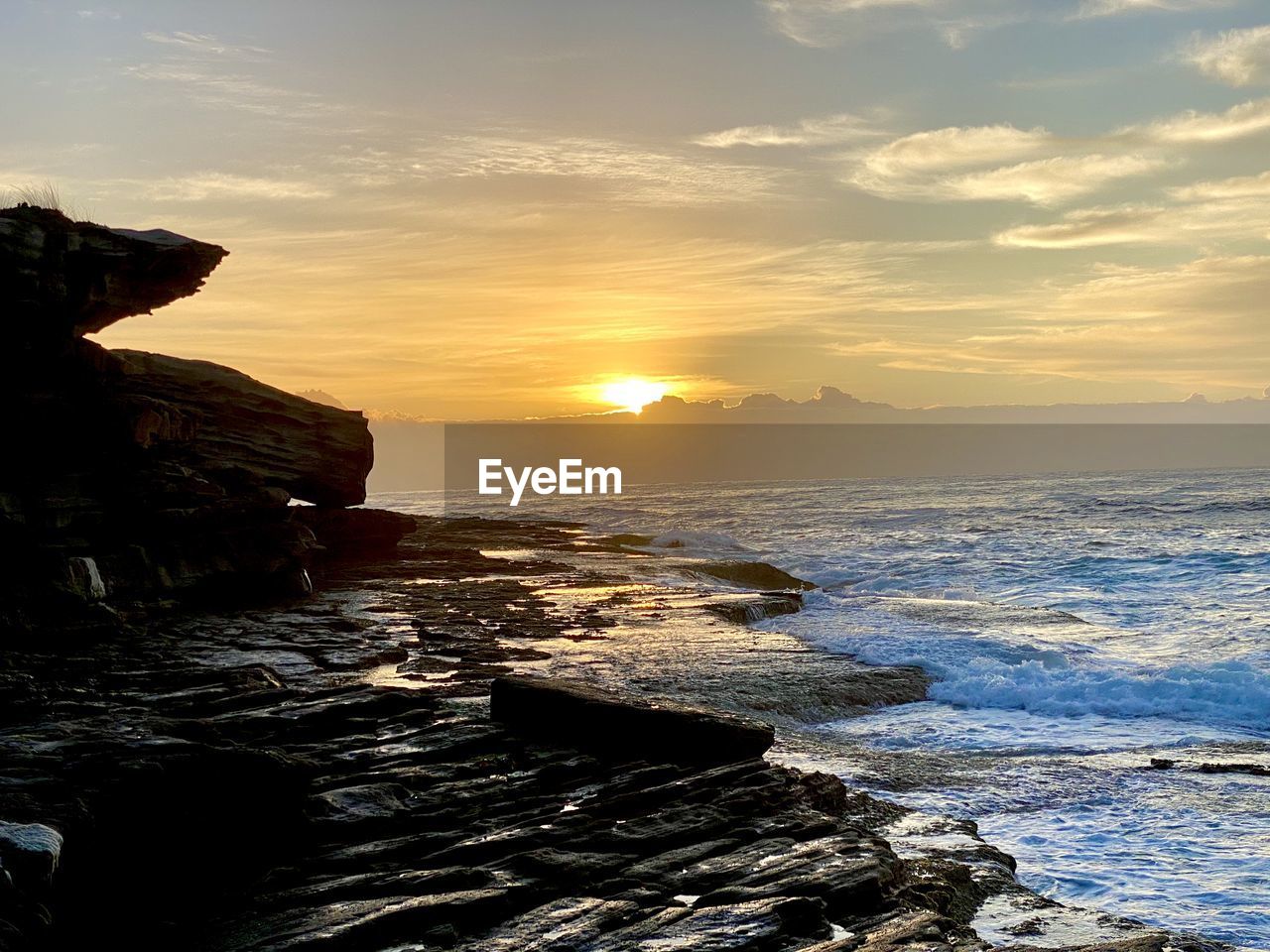 Scenic view of sea against sky during sunset